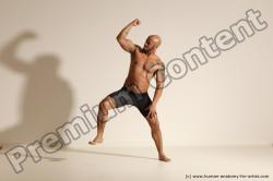 Underwear Gymnastic poses Man Black Muscular Bald Dancing Dynamic poses Academic